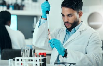 Science, man with blood in pipette and laboratory research, results and medical engineering. Biotechnology, pharmaceutical study and DNA test, scientist or lab technician with solution in glass.