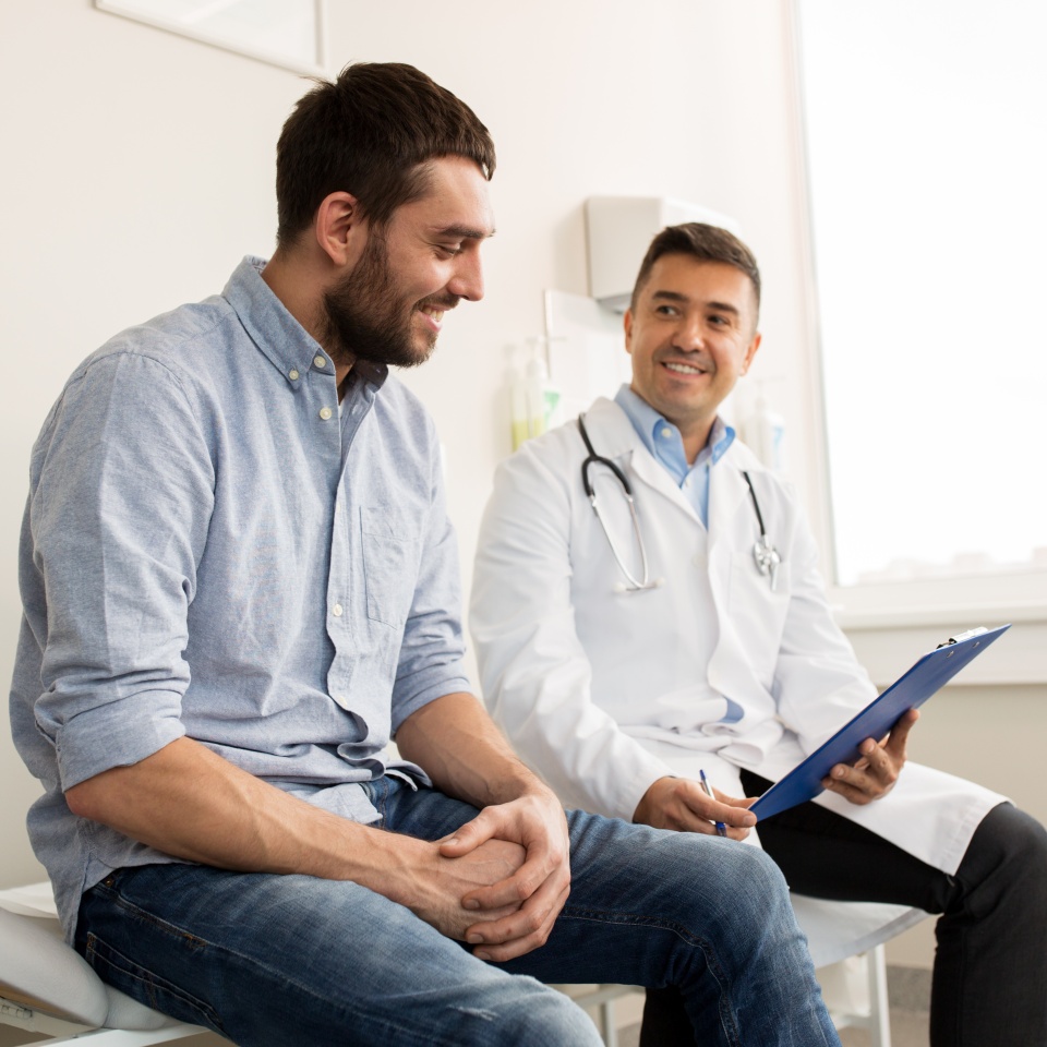 Doctor meeting with a male patient during a medical consultation