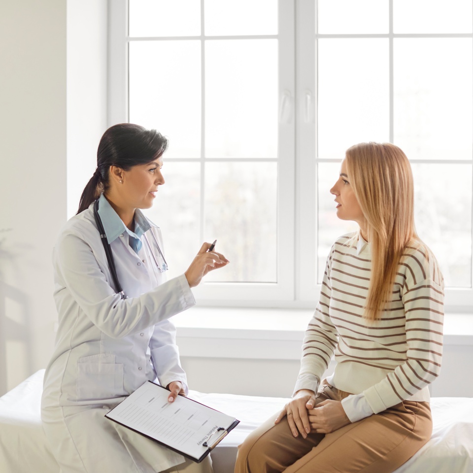 Feminist health clinic, supporting caring female doctor meeting, greeting, consulting young woman patient, offering medical advice in gynecology, sexual health, fertility, menopause, helping